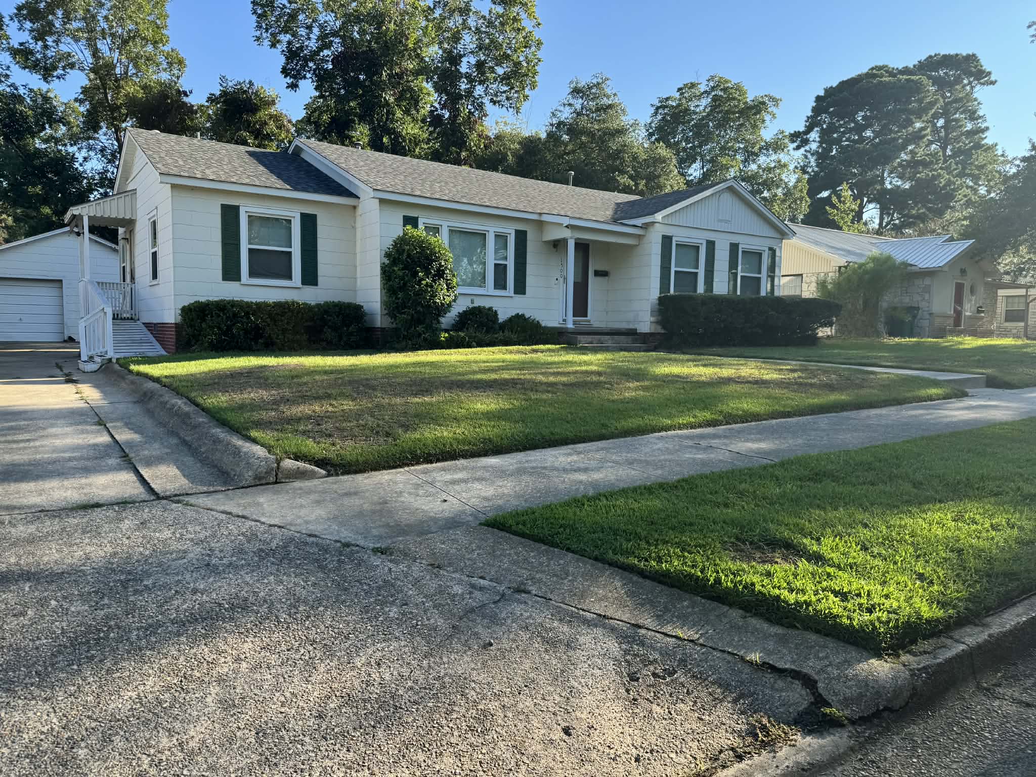 Beautiful lawn maintained by Southern Roots Lawn Co.